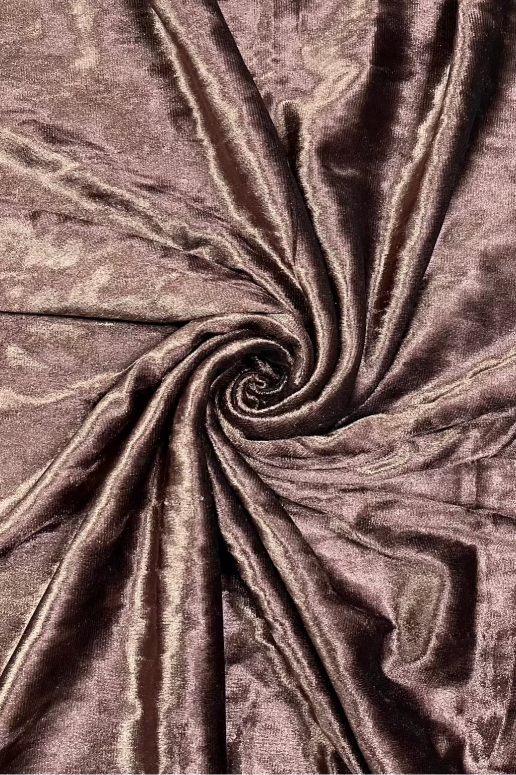 Close-up of brown textured fabric with a swirl pattern