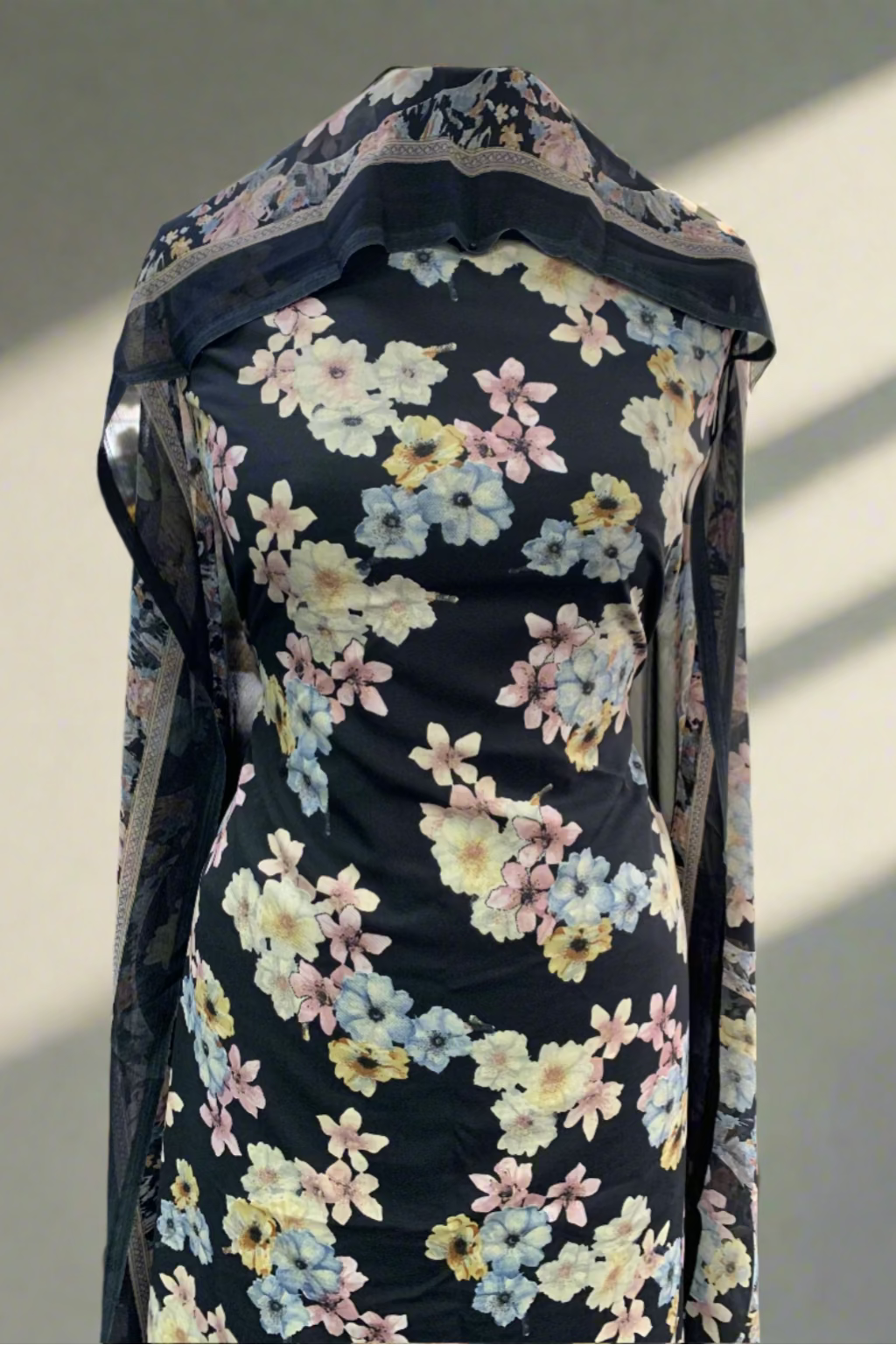 Floral-patterned fabric on a mannequin in a store setting