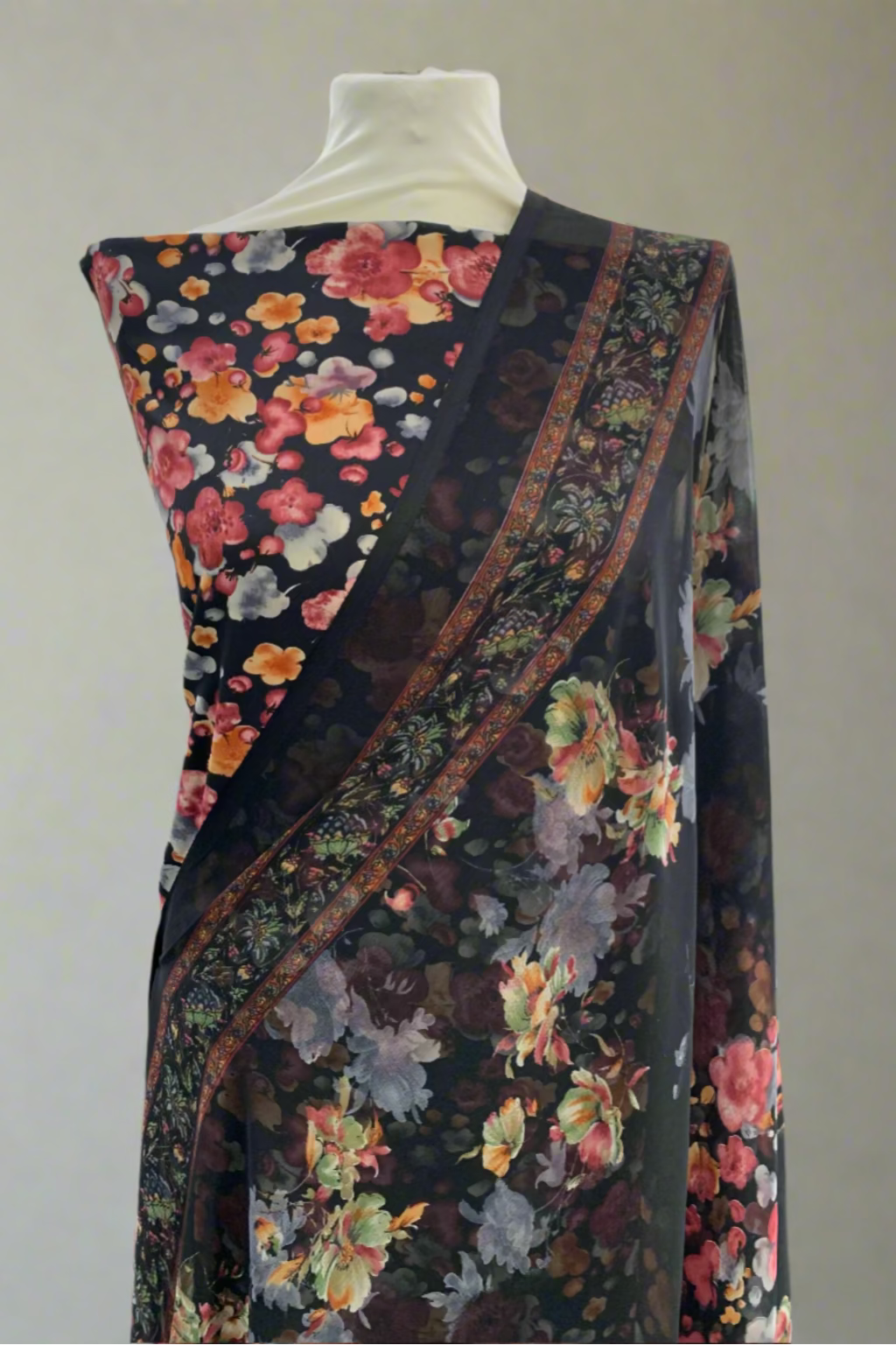 Floral patterned fabric draped over a mannequin in a store setting