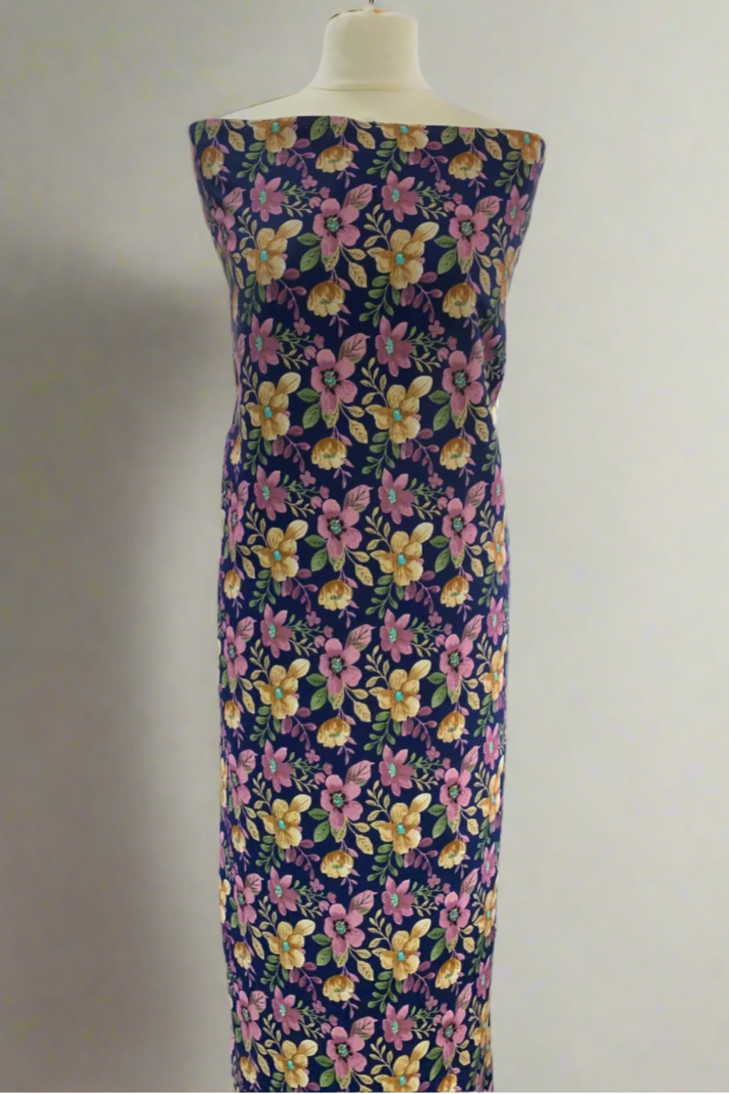 Floral dress on a mannequin in a store setting