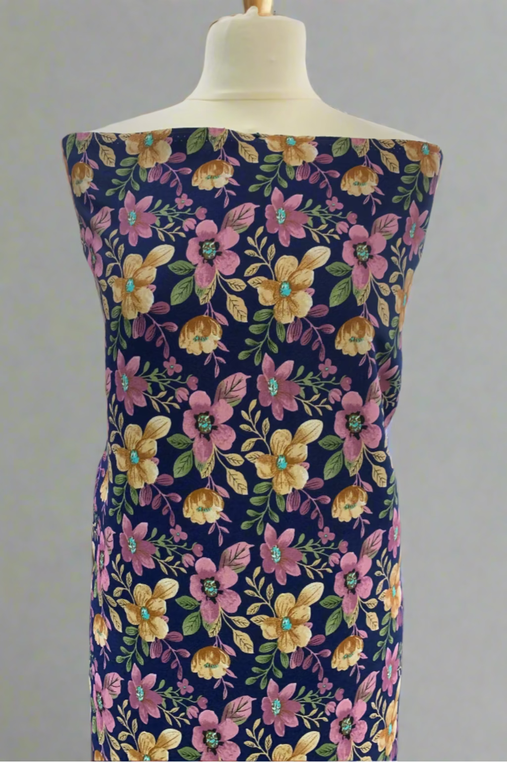 Floral dress on a mannequin in a store setting