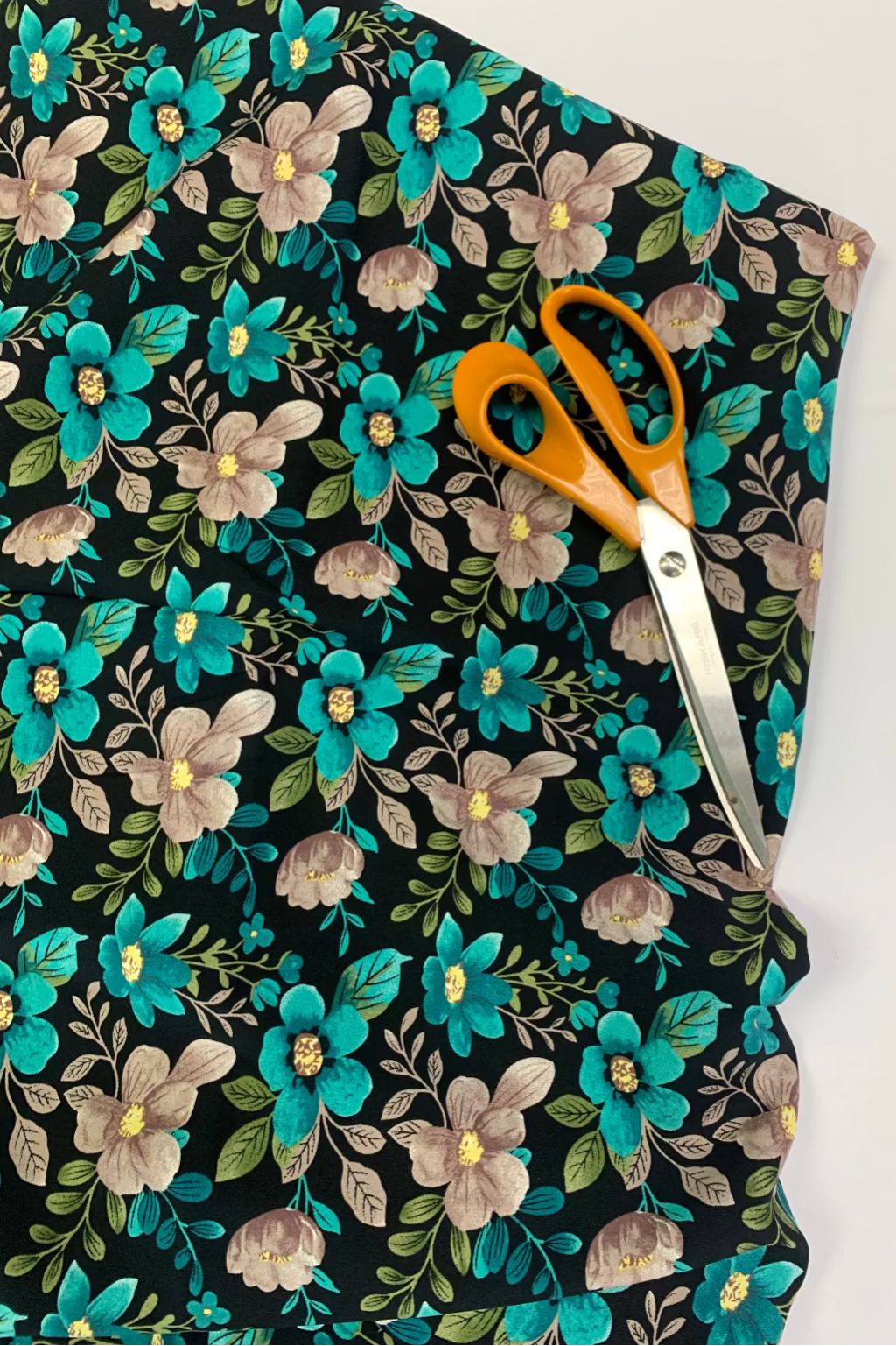 Floral fabric with scissors on a white background