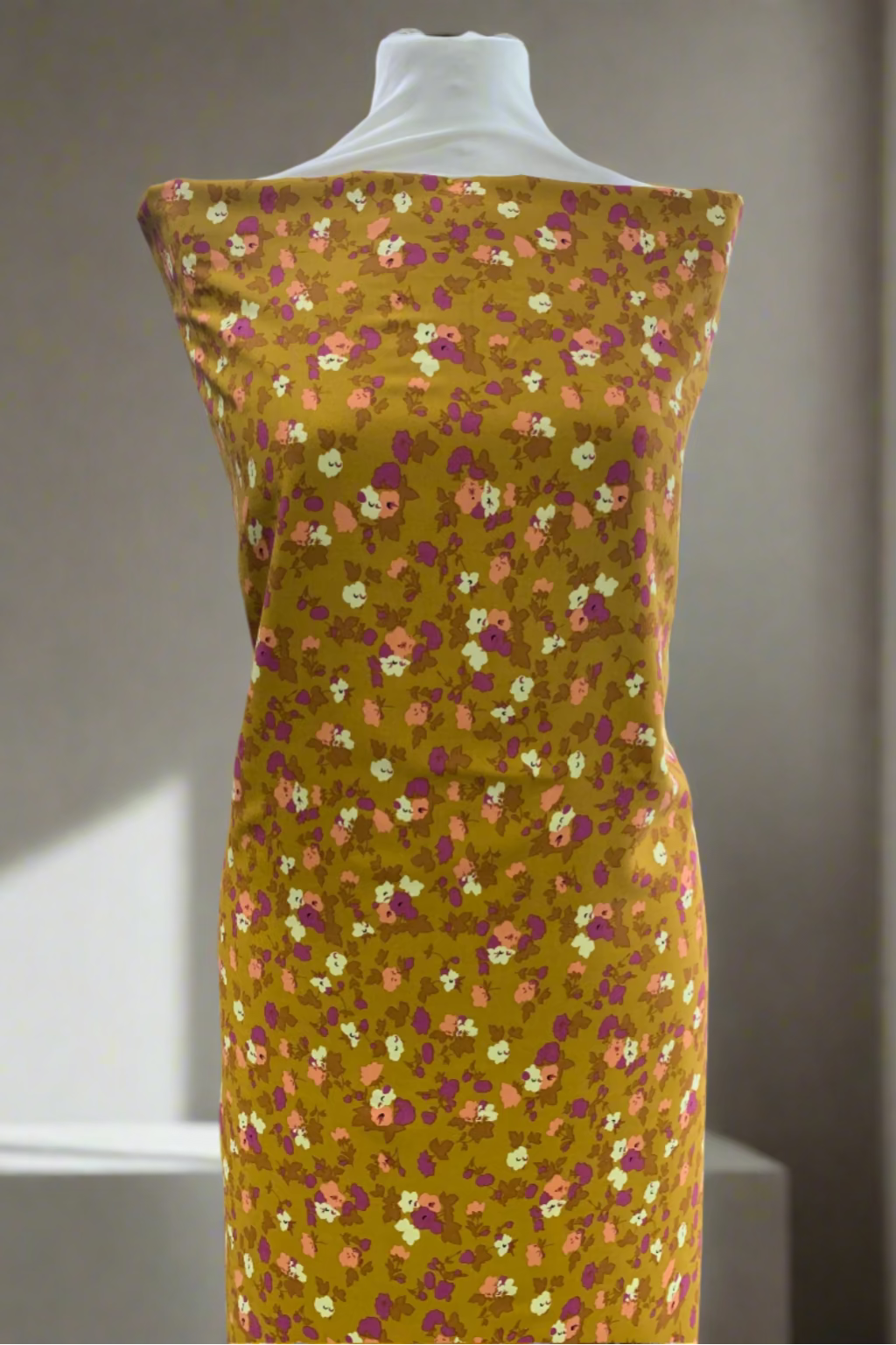 Floral dress on a mannequin in a fabric store