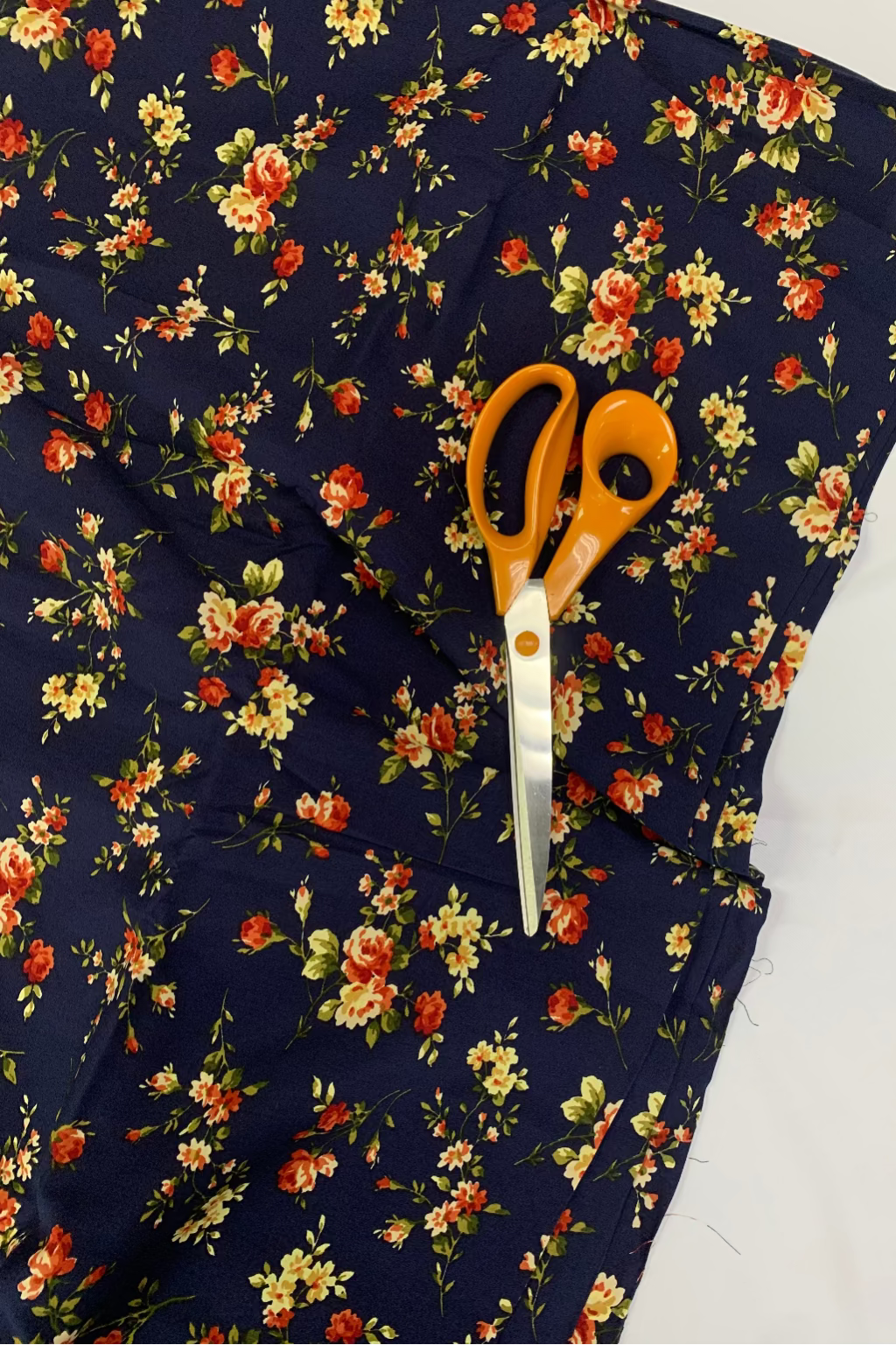 Floral fabric with scissors on a white background