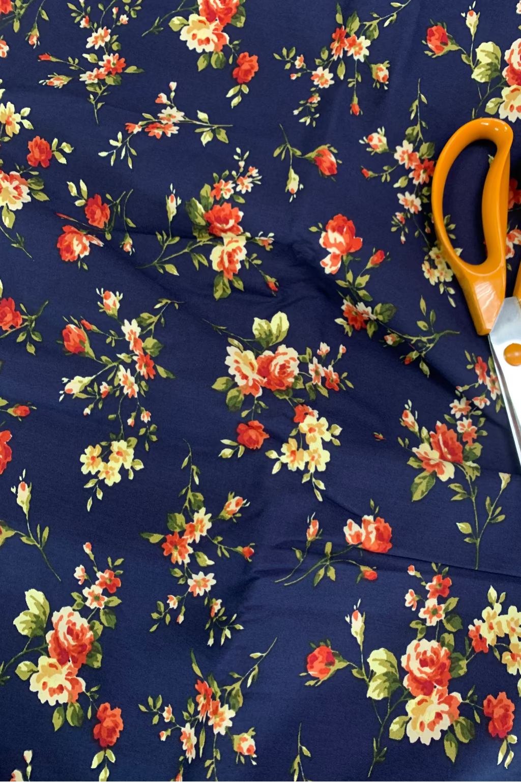 Floral fabric with scissors on a navy background