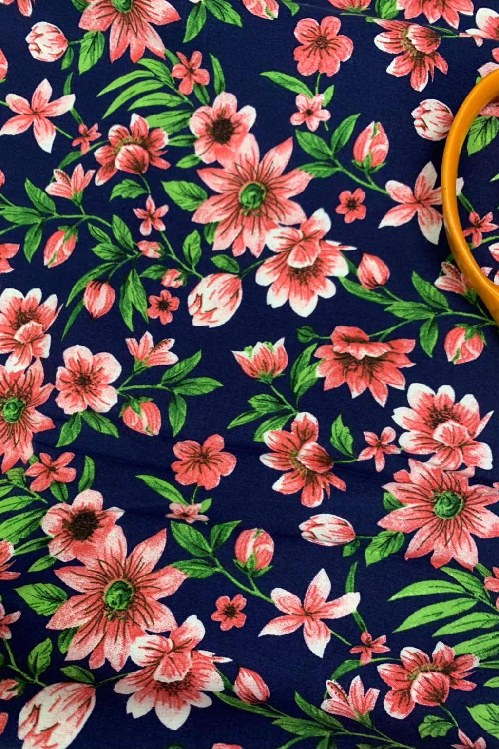 Floral pattern with pink flowers on a dark blue background