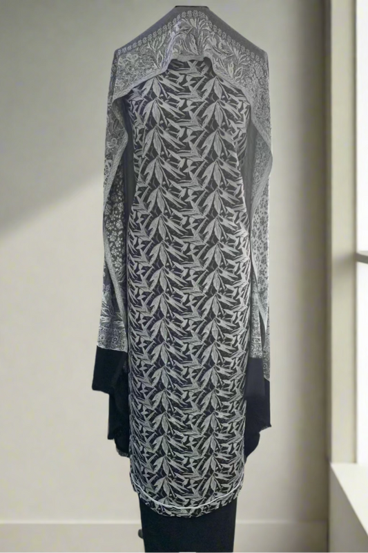 Black and white patterned dress on a mannequin in a store setting