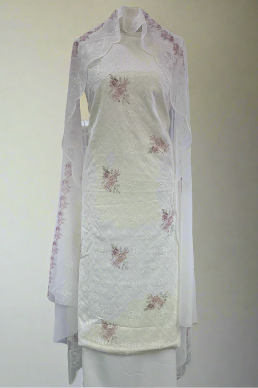White floral dress on a mannequin in a store setting