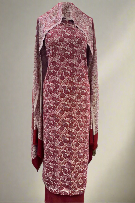 Red floral dress on a mannequin in a store setting