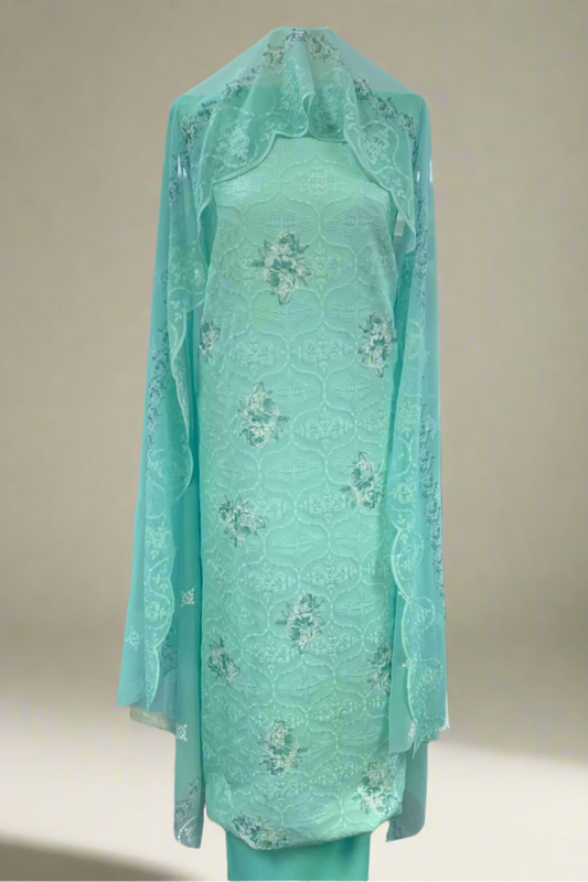 Light blue embroidered dress on a mannequin in a store setting