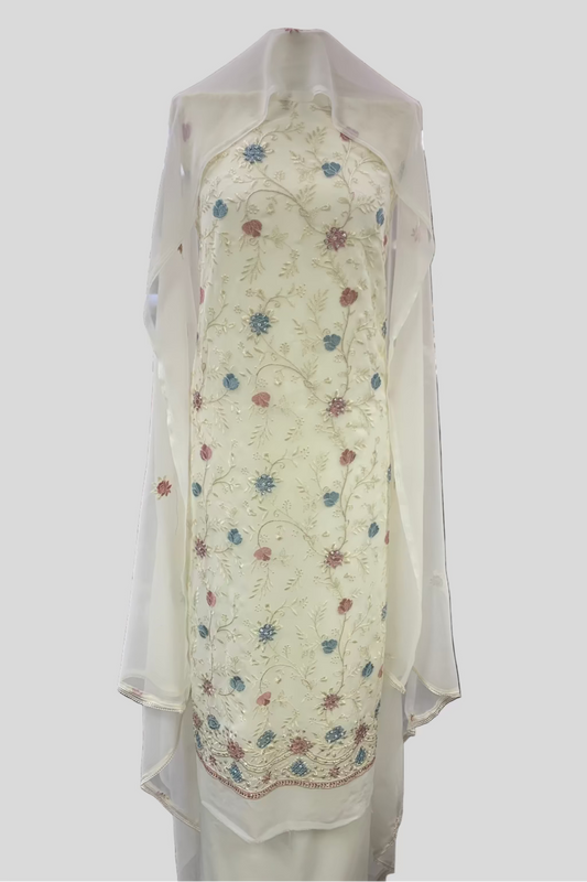 Floral-patterned garment with sheer overlay in a store setting