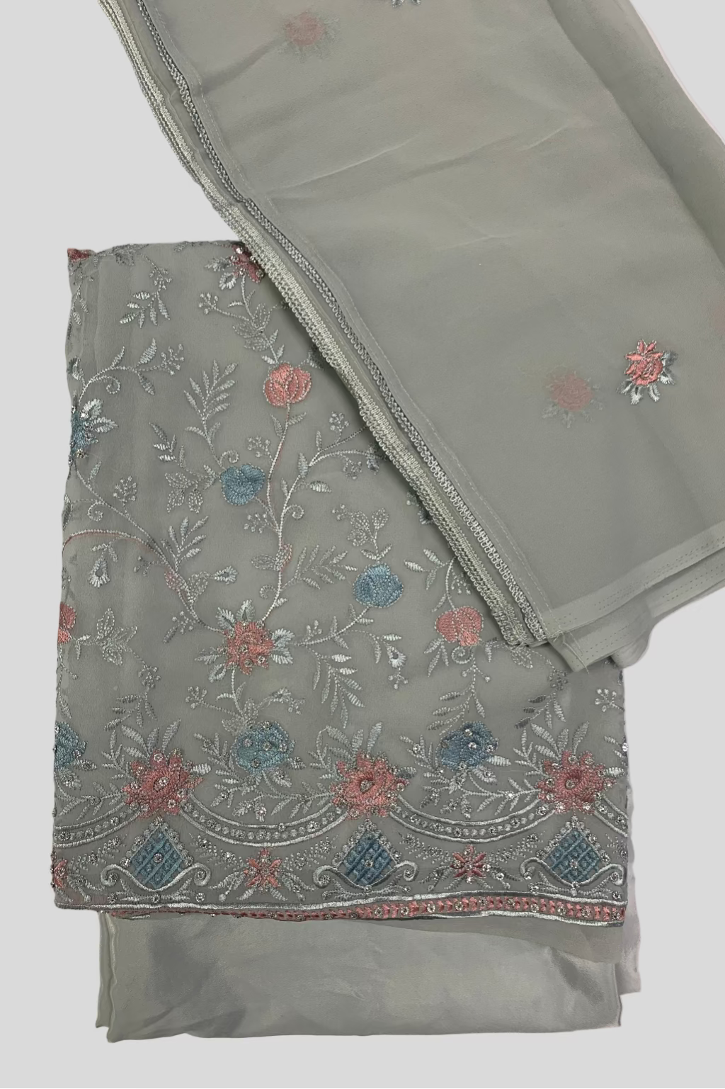 Light blue fabric with floral embroidery on a white background
