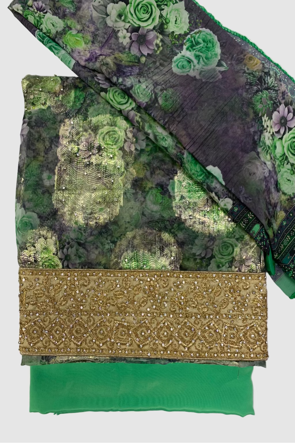 Green fabric with floral patterns and gold border on a white background