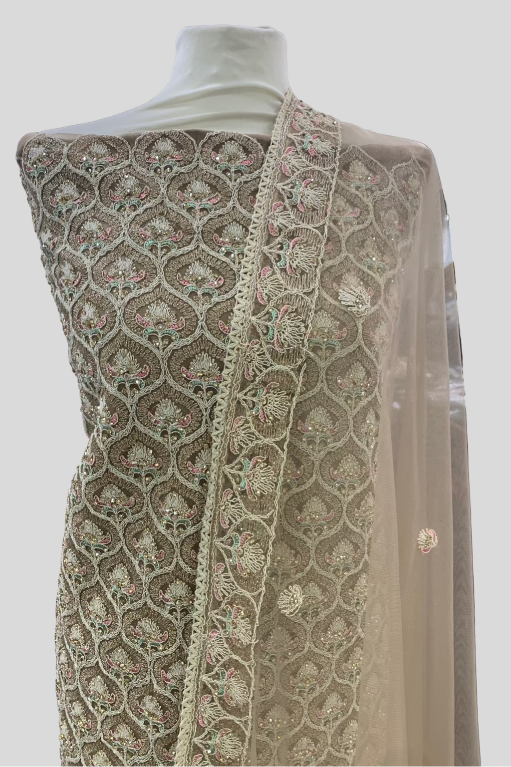 Embroidered fabric on a mannequin in a store setting