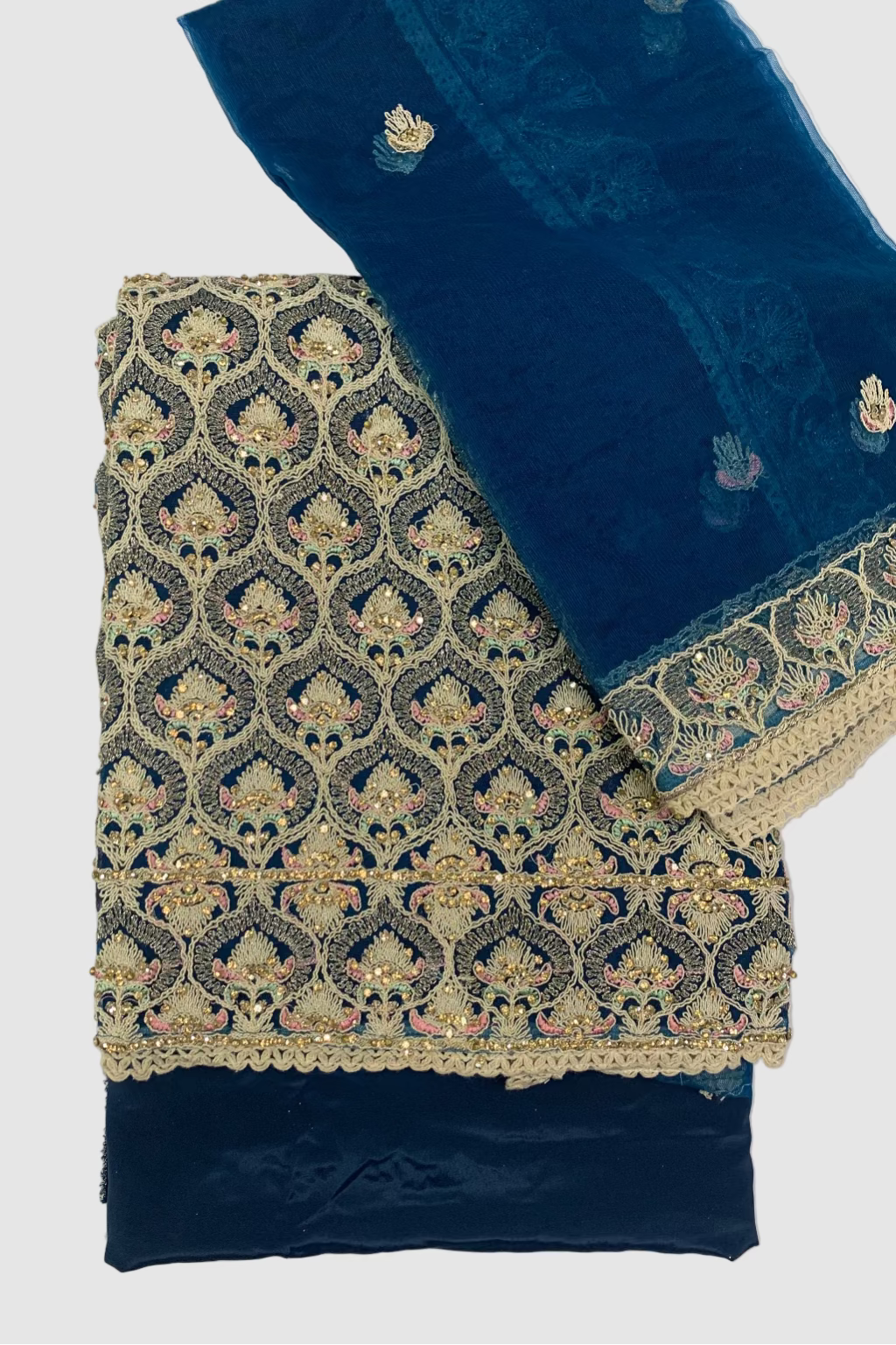 Teal fabric with intricate gold embroidery on a white background
