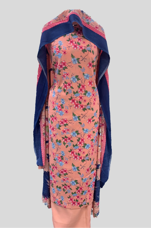 Floral dress with blue trim on a mannequin in a store setting