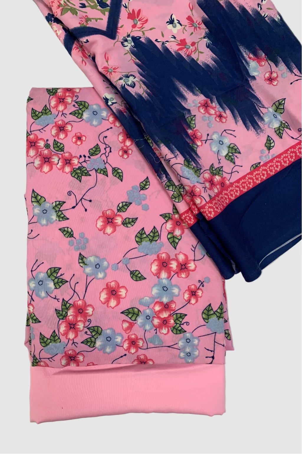 Pink floral dress with navy accents on a light gray background