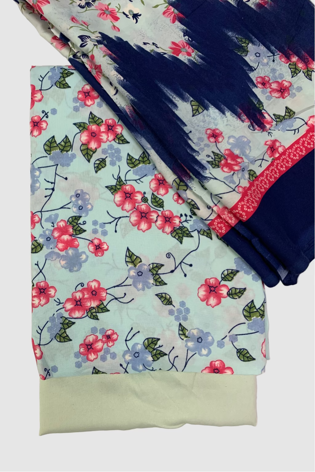Floral-patterned fabric with a blue border on a light background