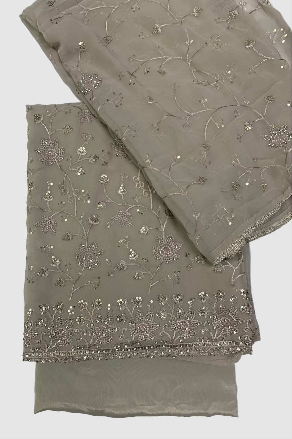 Two folded fabric pieces with floral embroidery on a white background