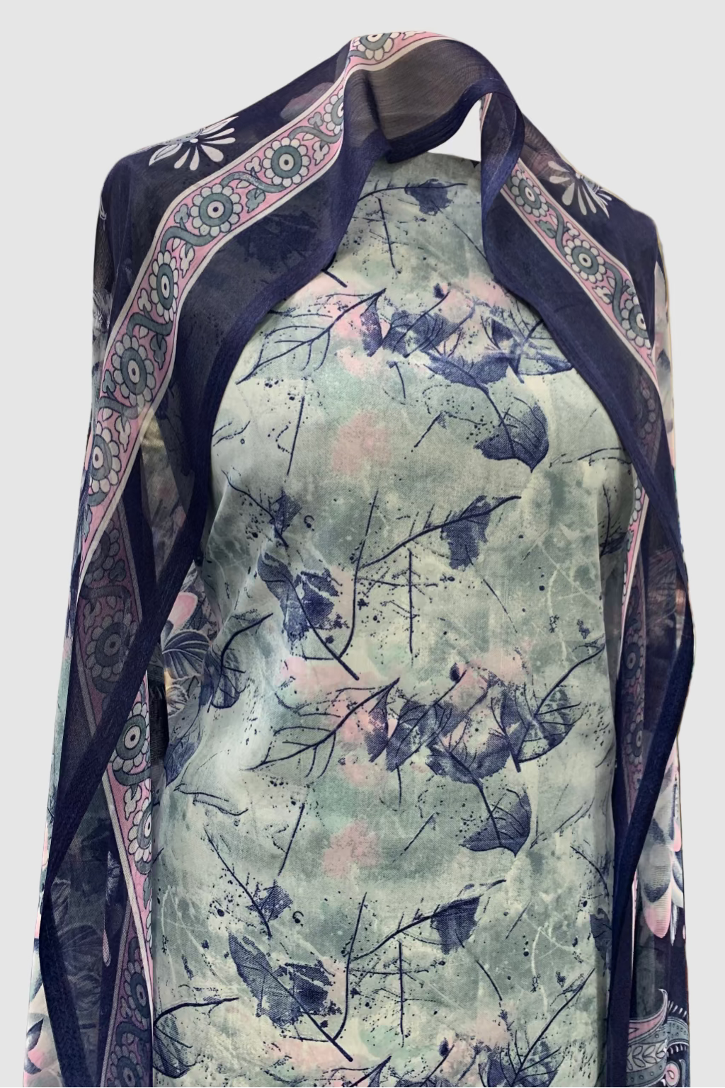 Floral patterned fabric with decorative border in a store setting