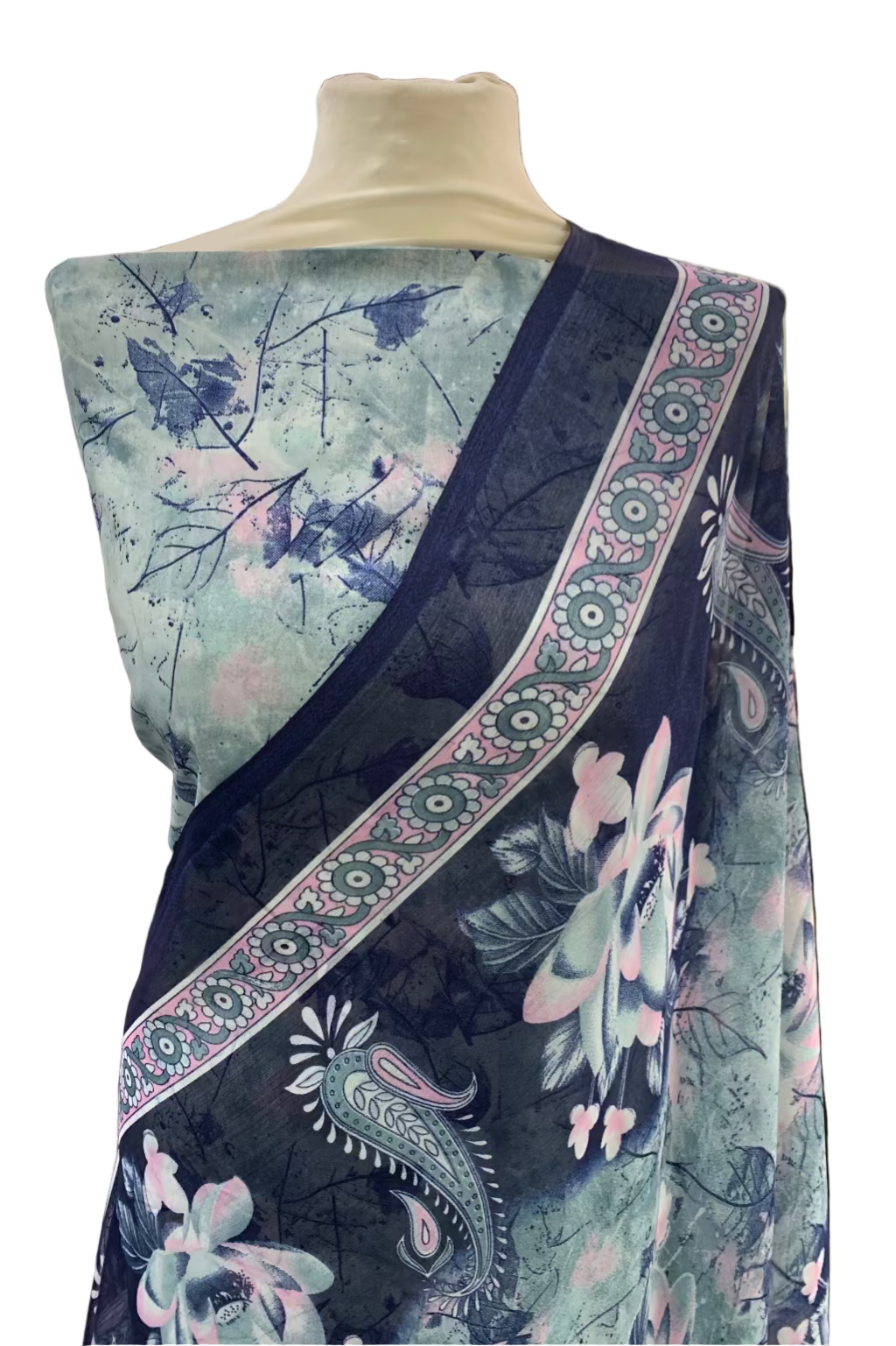 Fabric with floral and paisley patterns on a mannequin in a store setting
