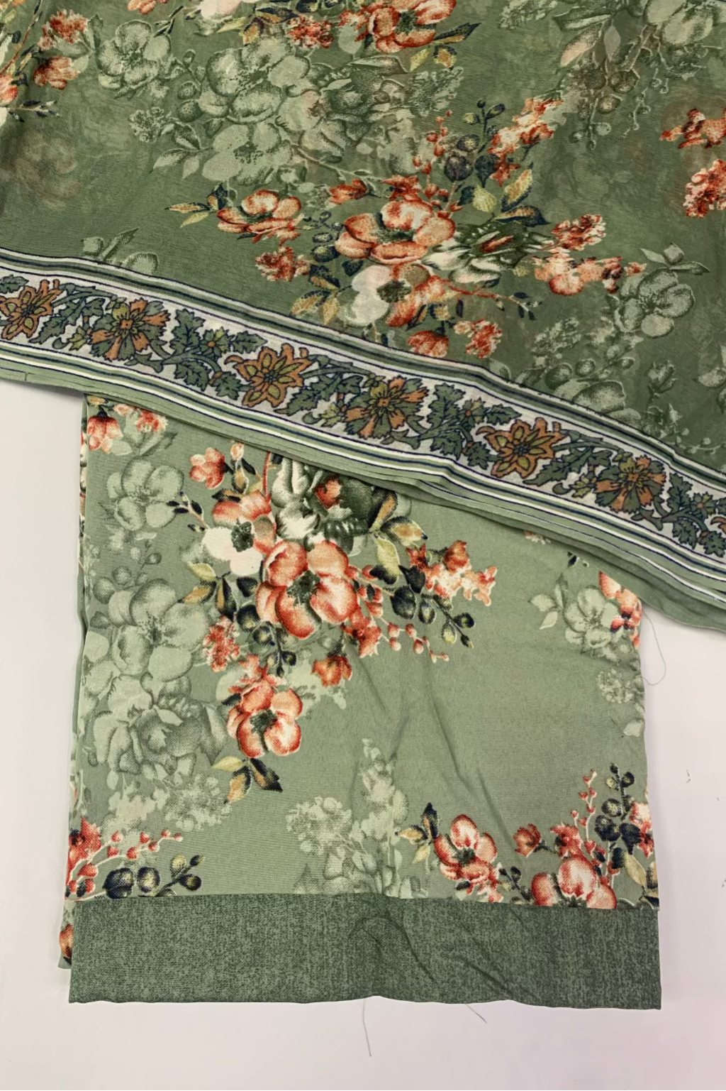 Floral patterned fabric with a green background