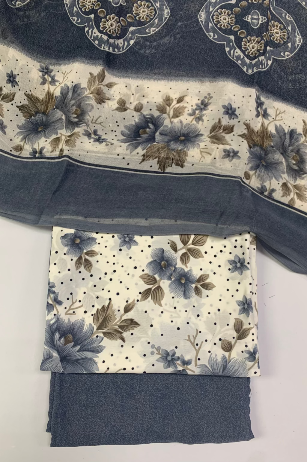 Floral-patterned fabric swatches on a white background