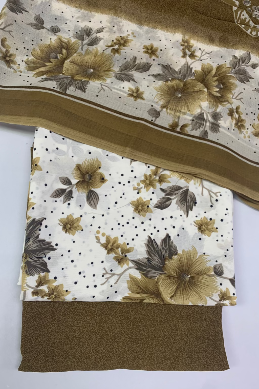 Fabric swatches with floral and polka dot patterns on a white background