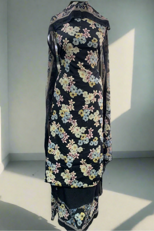 Black floral dress on a mannequin in a store setting