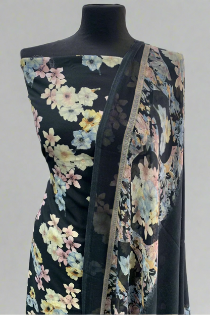Black floral dress on a mannequin in a fabric store.