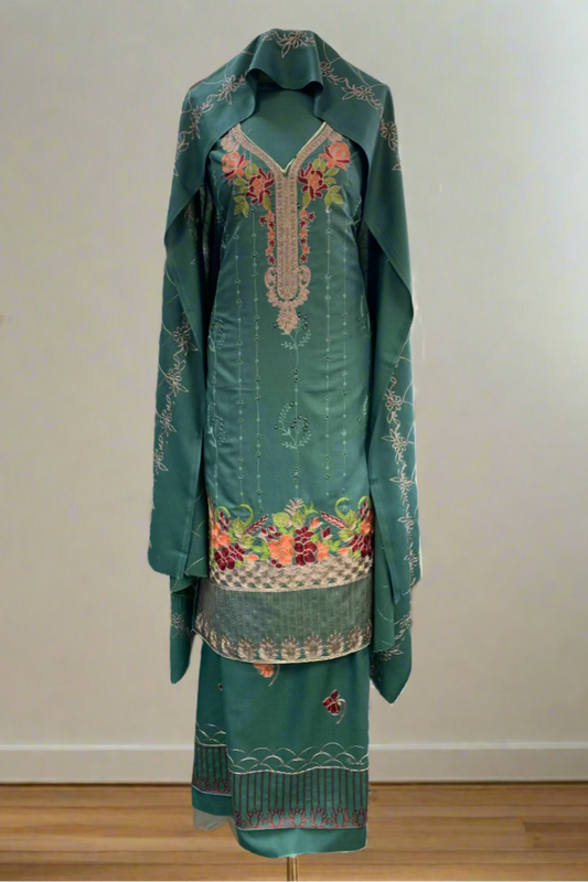 Green embroidered traditional outfit in a store setting