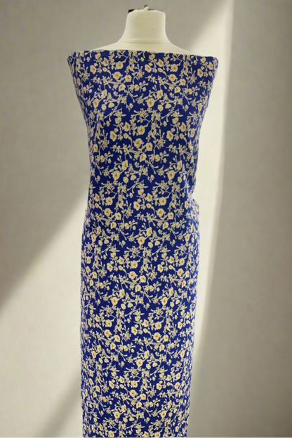 Blue floral dress on a mannequin in a fabric store