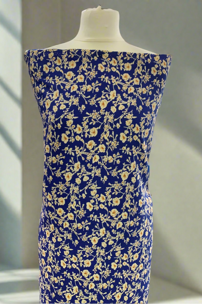 Blue floral dress on a mannequin in an indoor setting.