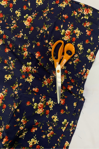 Floral fabric with scissors on a white background