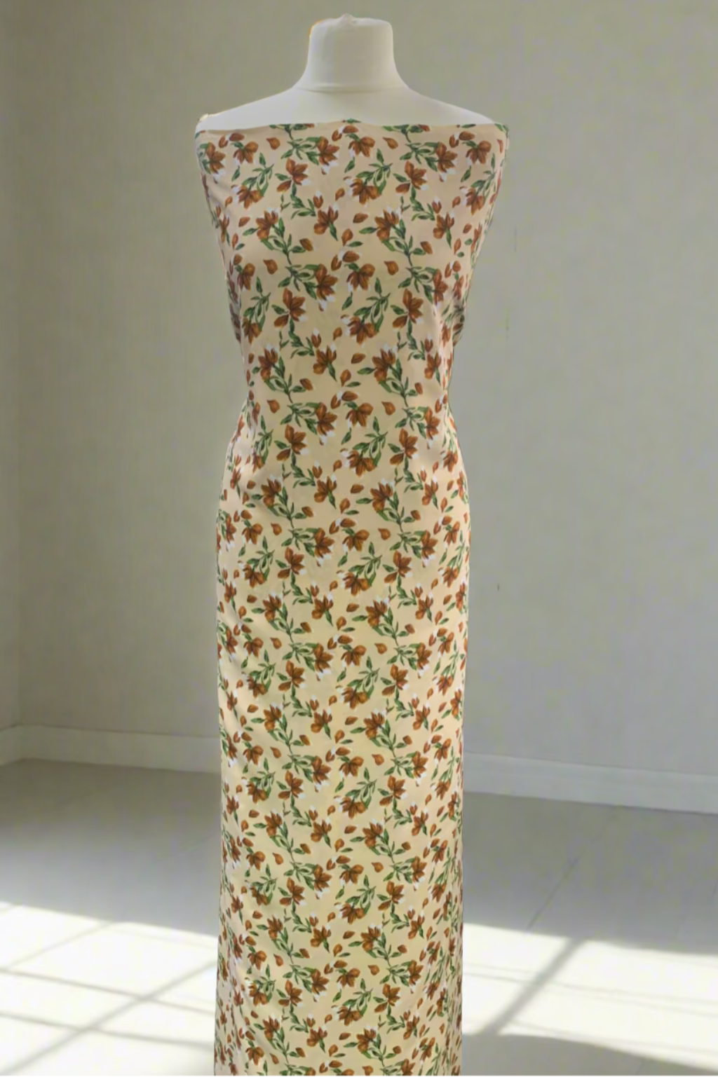 Mannequin wearing a floral dress in a fabric store