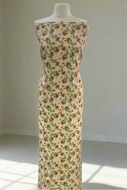 Mannequin wearing a floral dress in a fabric store