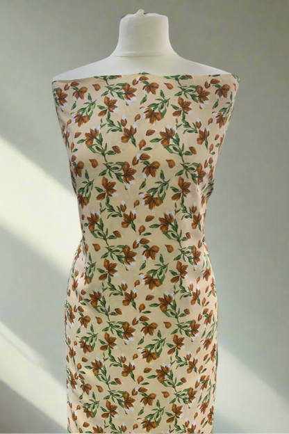 Mannequin wearing a floral dress in a store setting