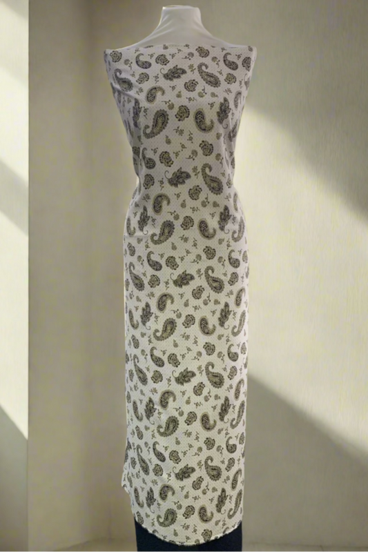 Mannequin wearing a patterned dress in a store setting