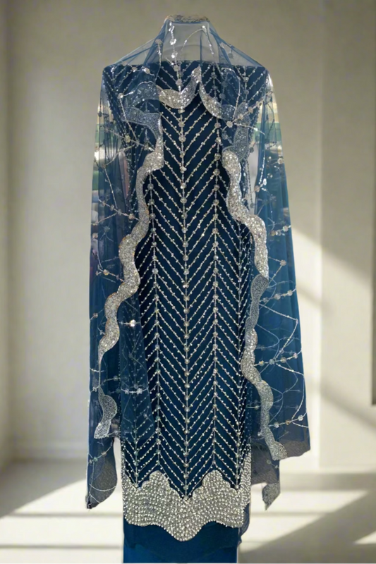 Blue beaded dress on a mannequin in a store setting