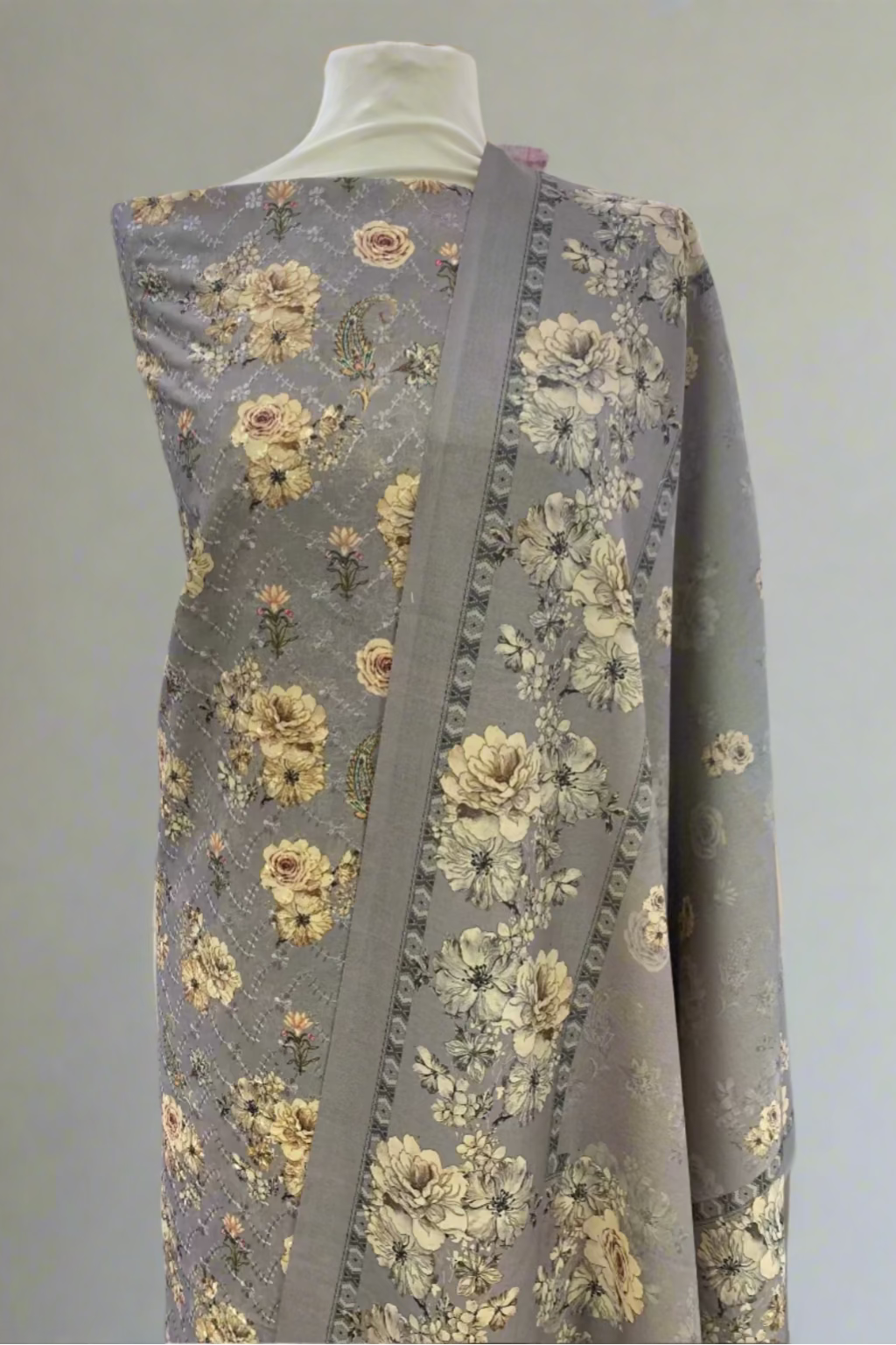 Floral-patterned fabric on a mannequin in a store setting