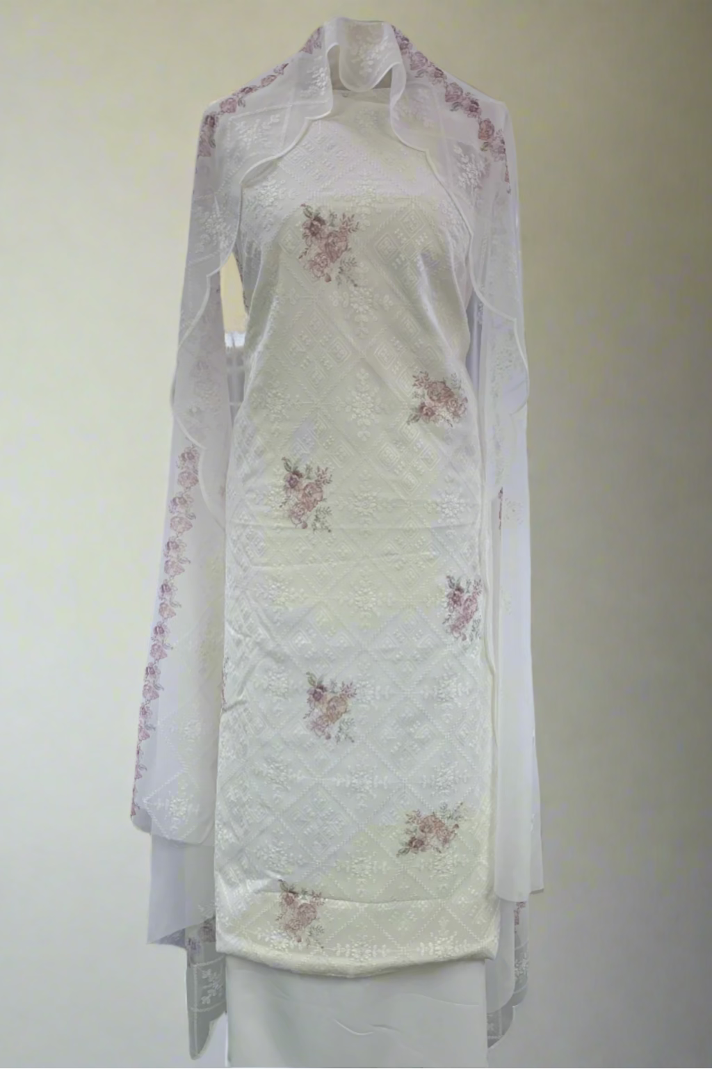 White floral dress on a mannequin in a store setting