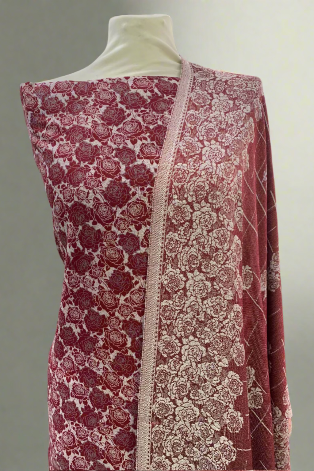 Red and white floral fabric on a mannequin in a store setting