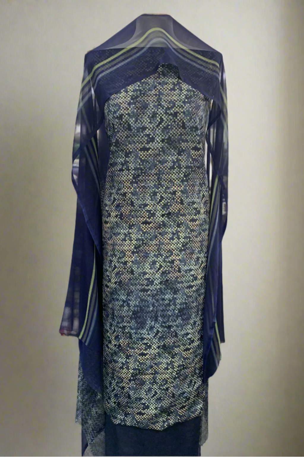 Blue patterned fabric on a mannequin in a store setting