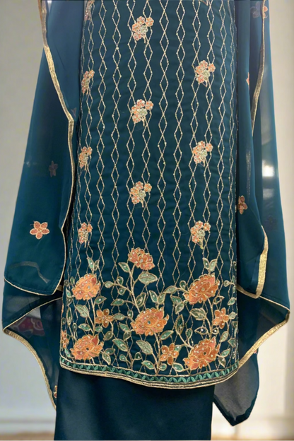 Blue embroidered garment with floral patterns in a store setting