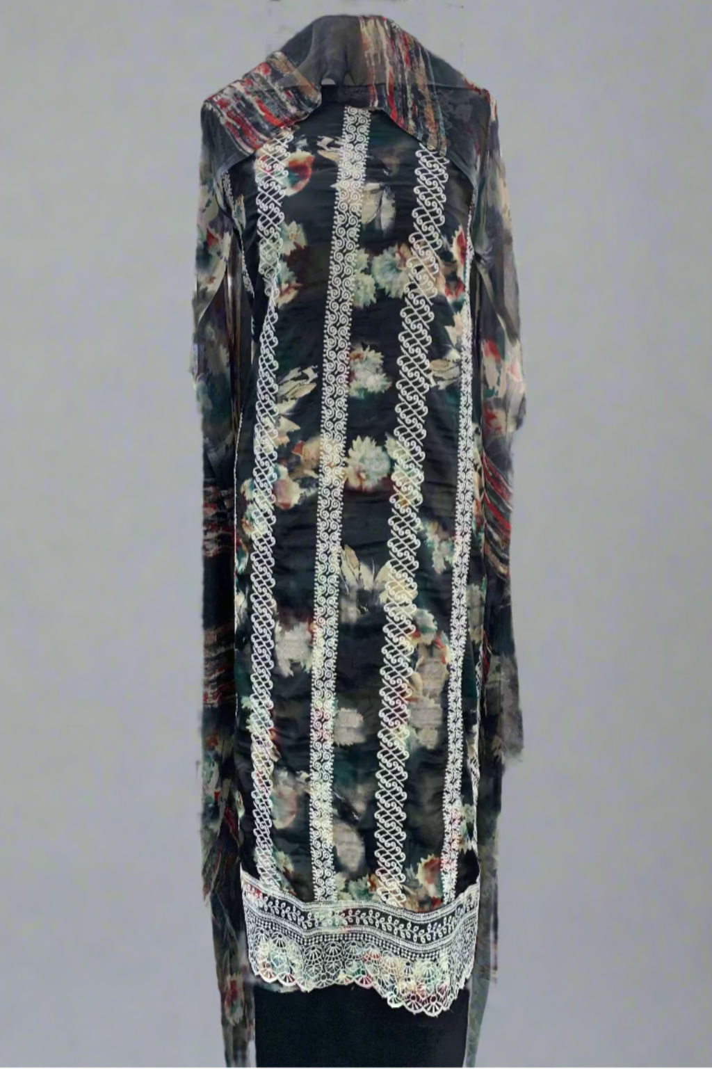 Floral dress with embroidery details on a mannequin in a fabric store.