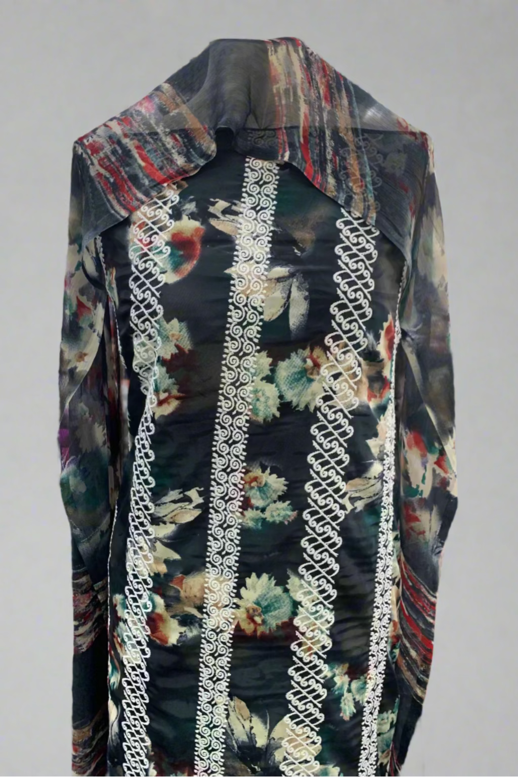 Floral patterned garment with embroidery trim in a fabric store setting