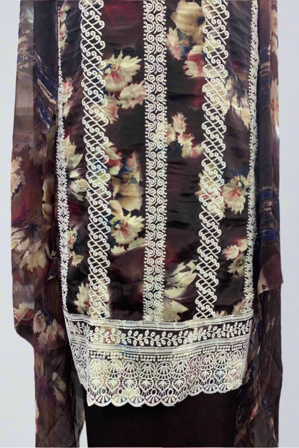 Floral patterned fabric with white embroidery trim in a store setting