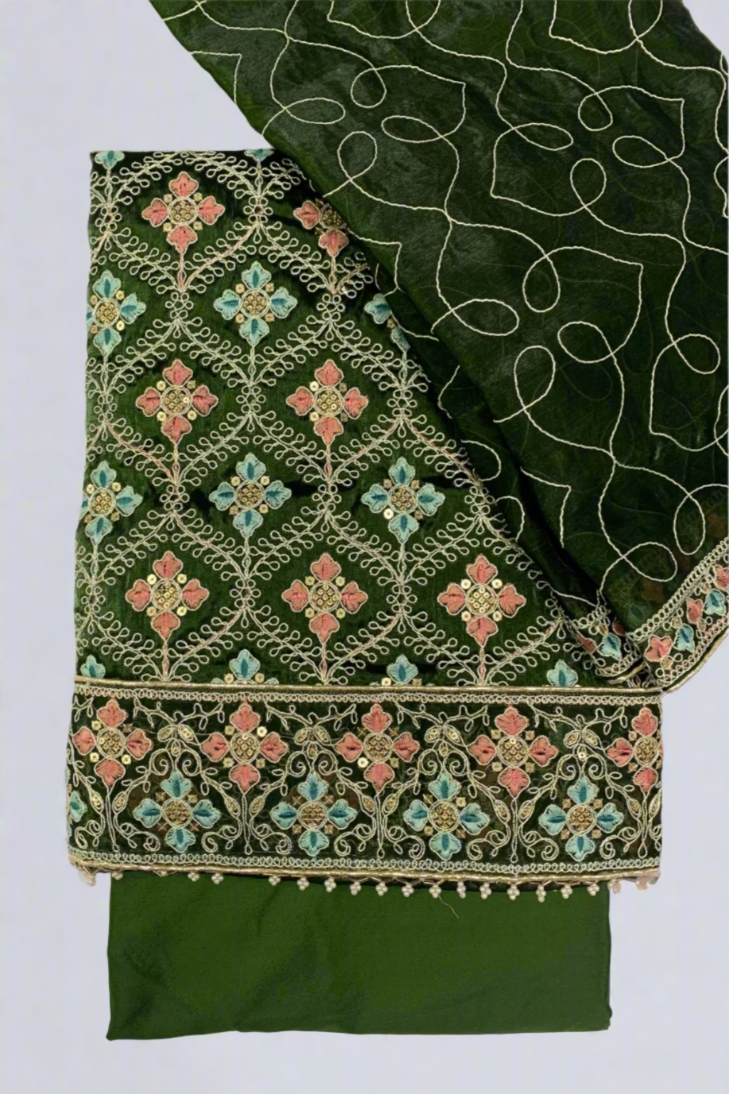 Green embroidered fabric with intricate patterns on a white background