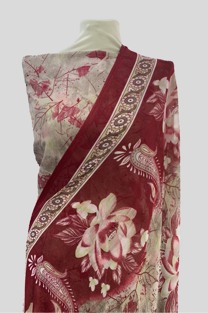 Red and white floral patterned fabric on a mannequin in a store setting
