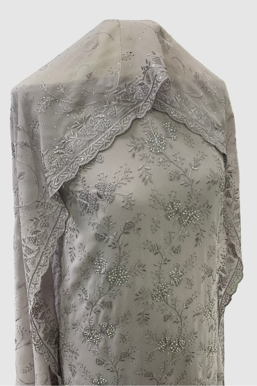 Lillac embroidered fabric on a mannequin in a store setting